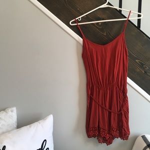 Brand new orange romper - lace detail, pockets